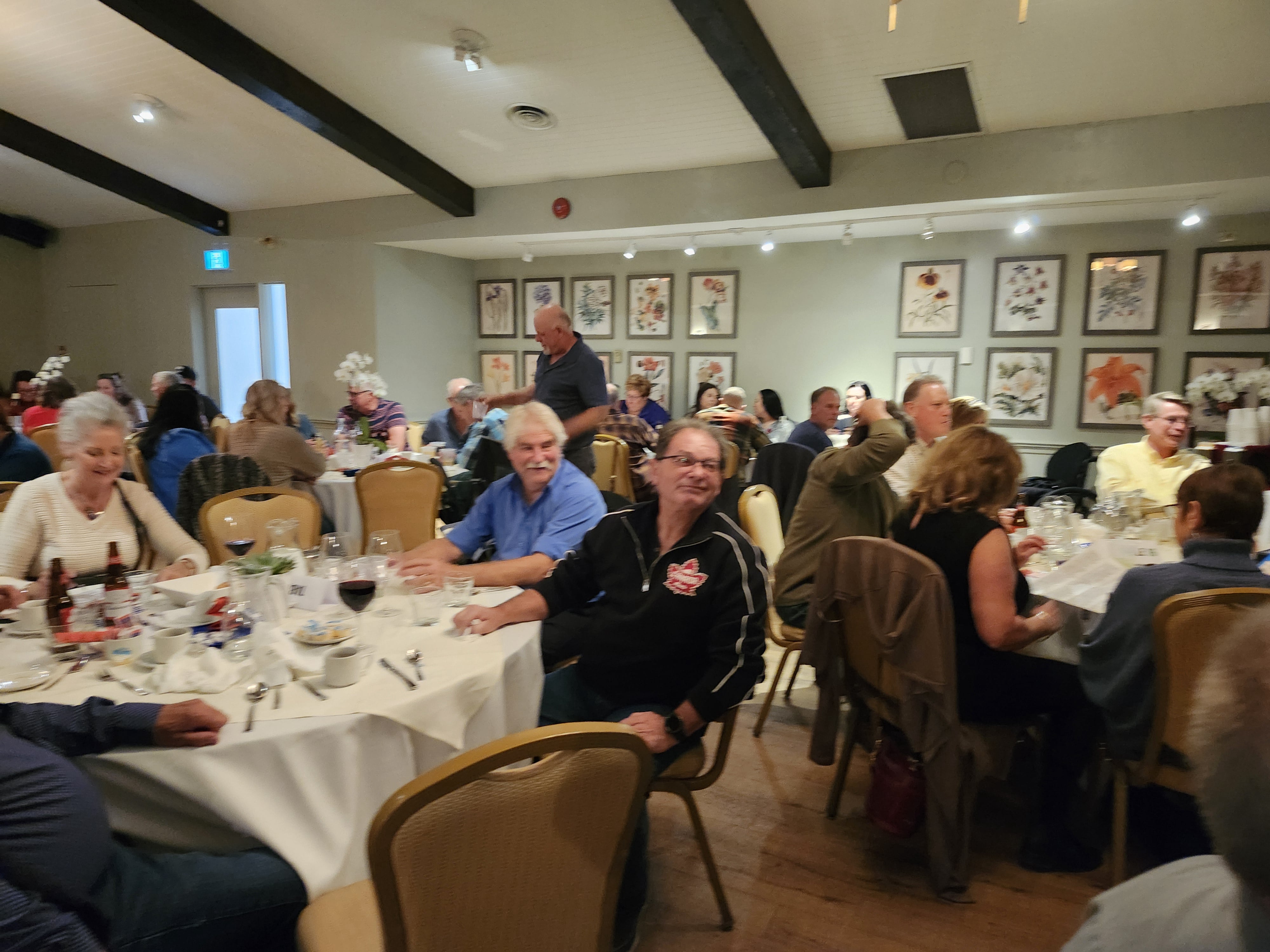 2024 Elimination Draw Attendees sitting around a table