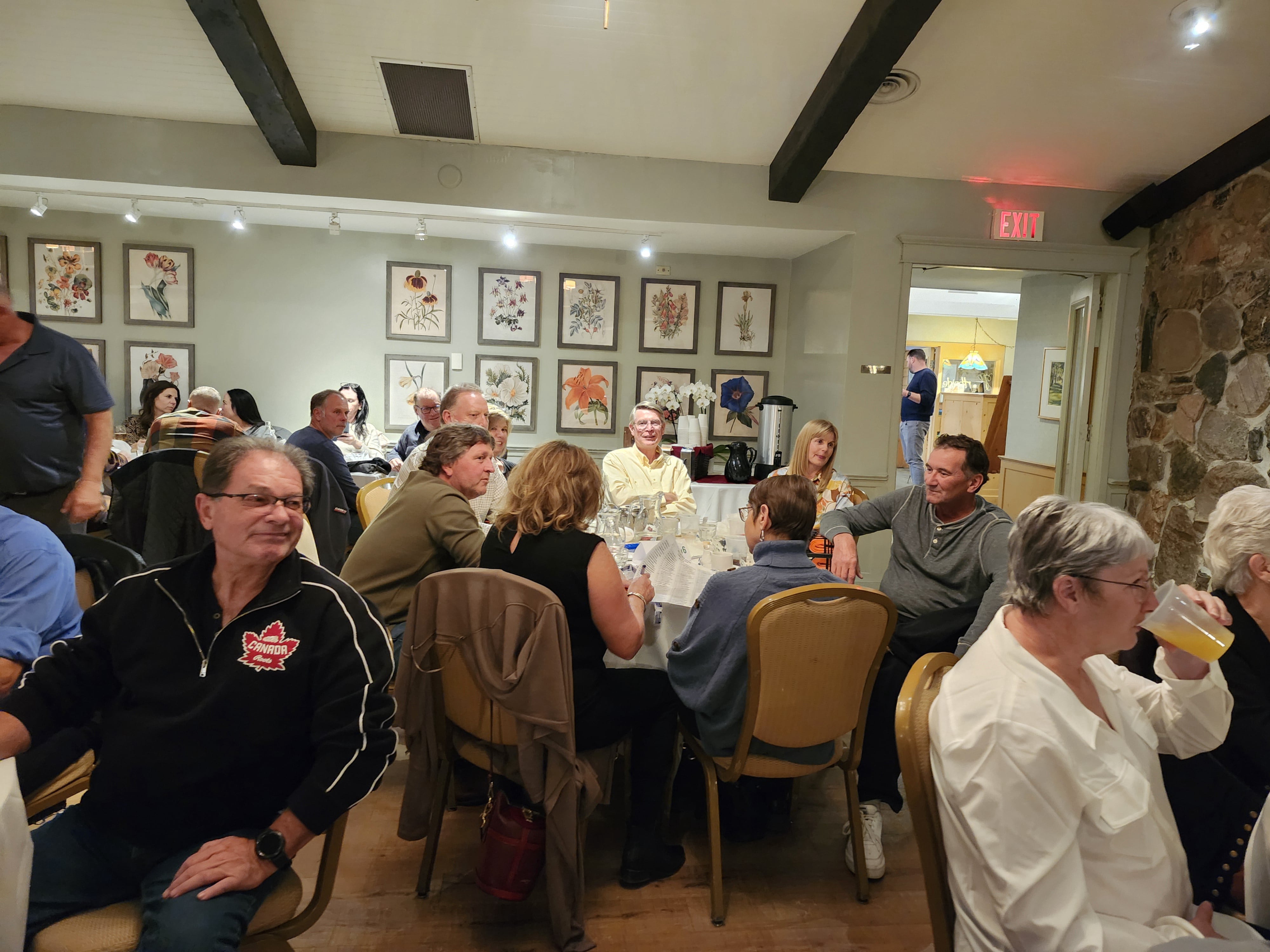 2024 Elimination Draw Attendees sitting around a table