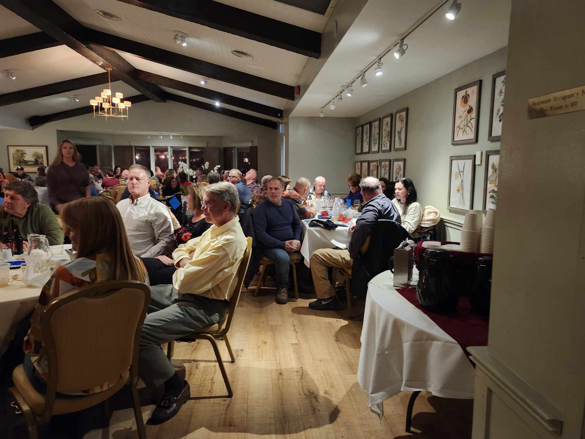 2024 Elimination Draw Attendees sitting around a table